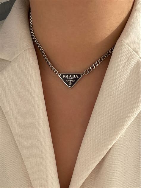 prada necklace gold and white|prada symbol necklace.